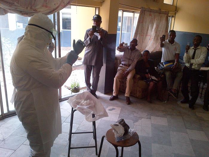 Healthcare workers being trained in use of personal protective equipment during Ebola epidemic